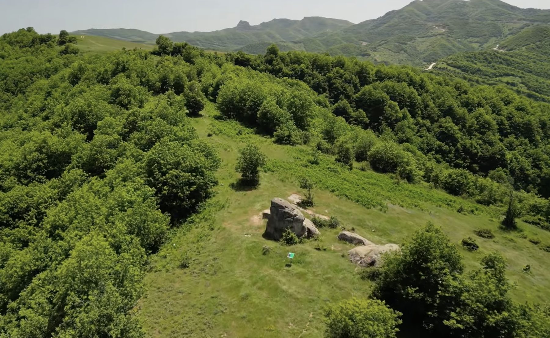 Aerial view of the rock formations on the Kabash Trail, with the Stone of Hol Brana placard
